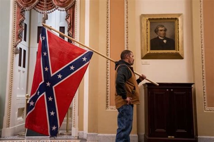 Capitol Rioter And Confederate Flag Bearer