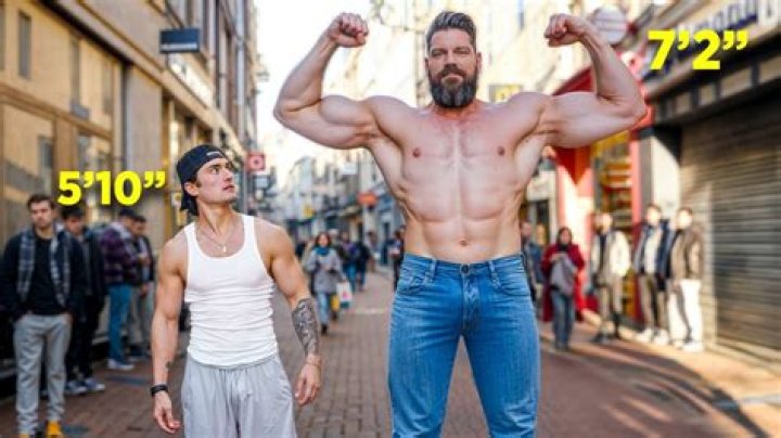 Standing Next to a Giant: Tallest Bodybuilder in the World Stuns Fitness Worldat Indiana Jone